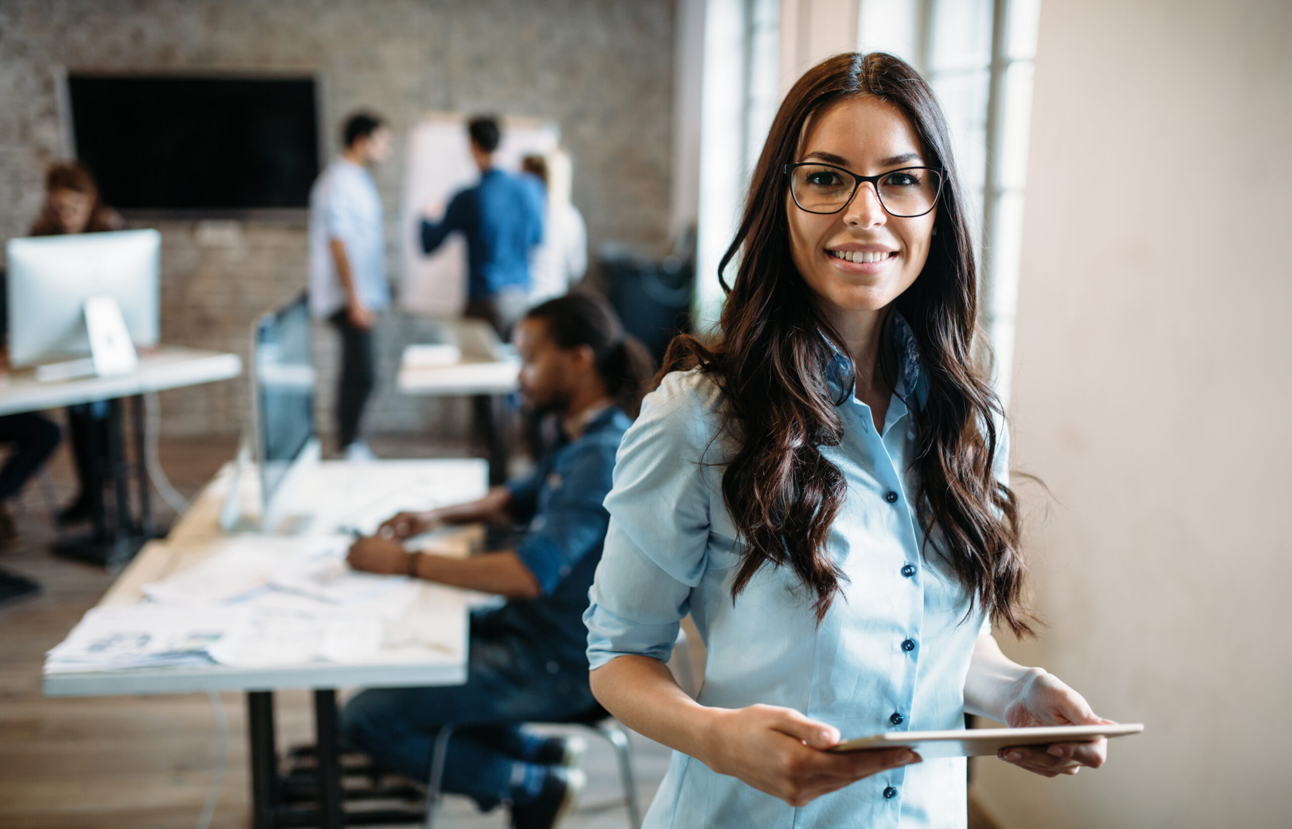 Young attractive architect working in modern office