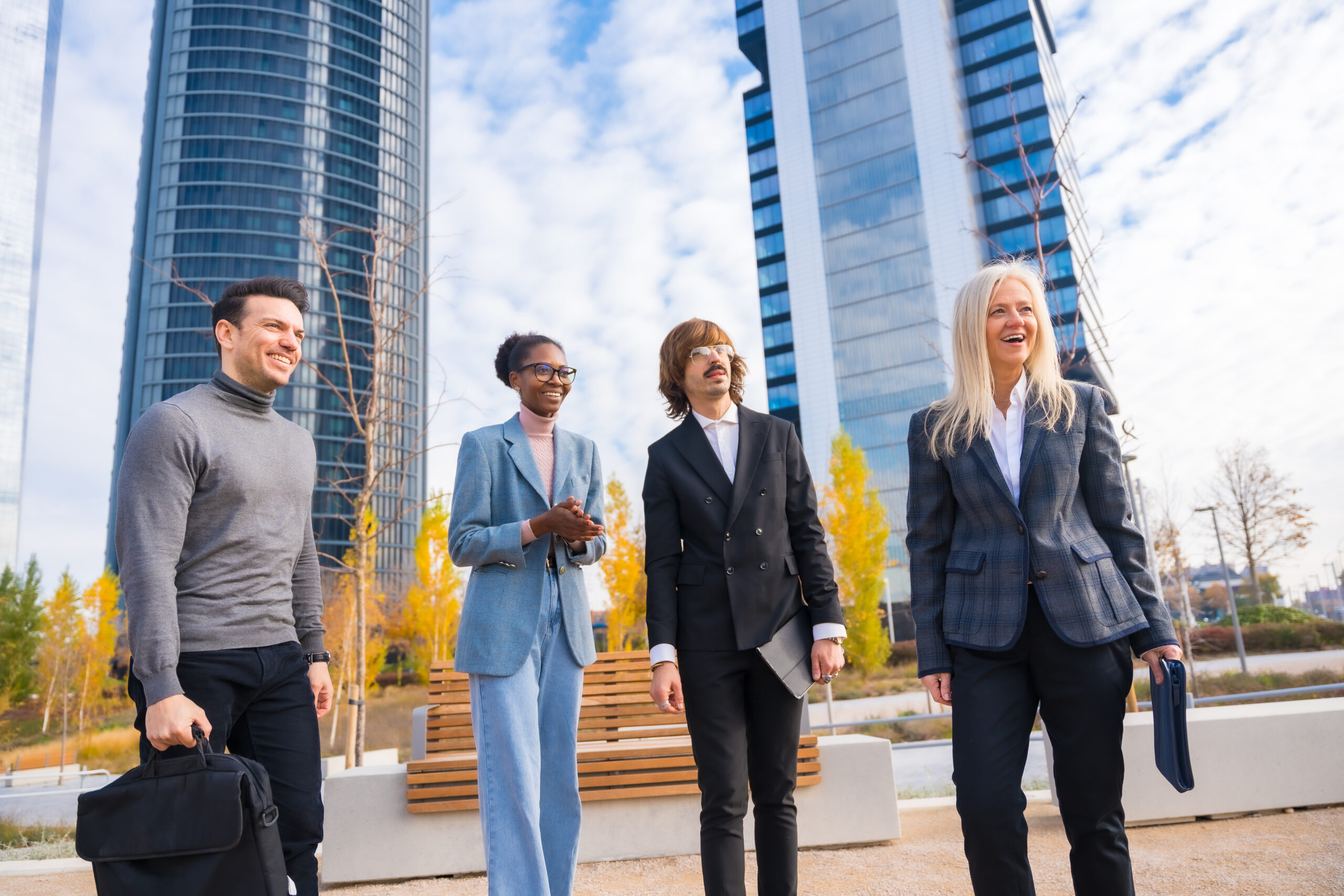 Group of multi-ethnic businessmen and businesswomen, talking about work in a business park